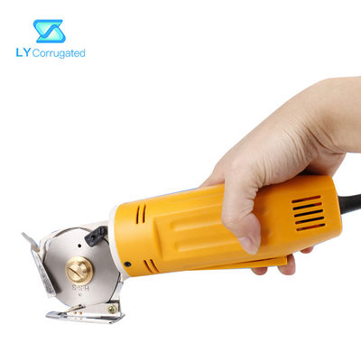 Forbici elettriche gialle del tessuto 170W intorno ai pezzi meccanici portatili del tessuto della lama di taglio