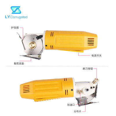 Forbici elettriche gialle del tessuto 170W intorno ai pezzi meccanici portatili del tessuto della lama di taglio